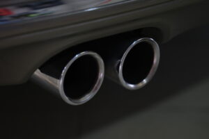 closeup metal exhaust pipe sports car