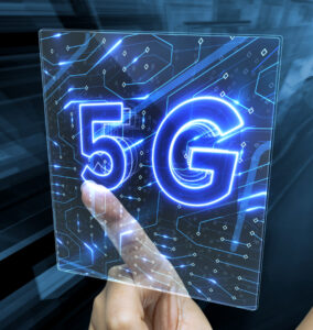 Female's hand touching a digital 3D render screen with 5G sign