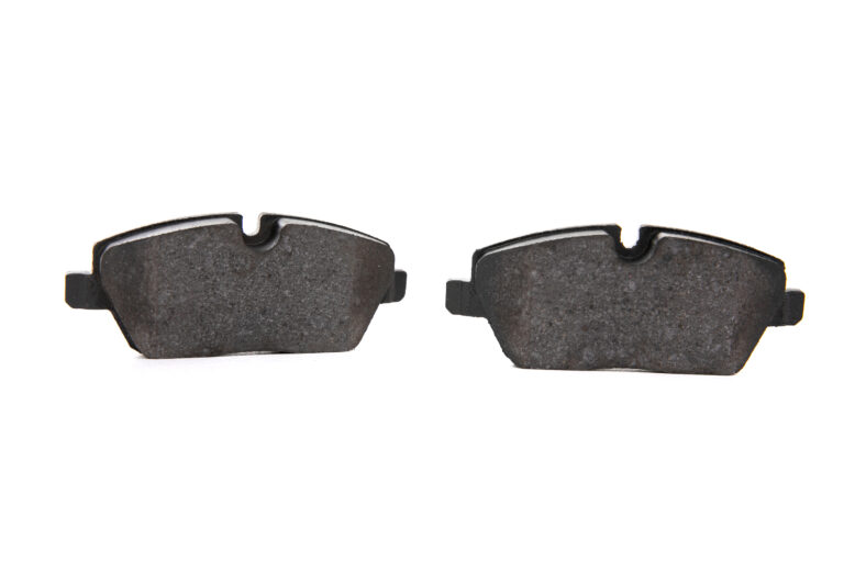 two brake pads isolated white background