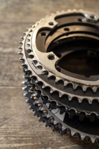 bicycle pieces wooden table high angle