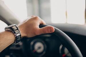 handsome man sitting car testing it