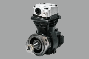 Compresor de frenos de aire de camión durante diagnóstico en taller.