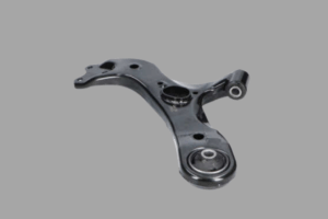 Mécanicien inspectant un bras oscillant pour vérifier les silentblocs et rotules défectueux.