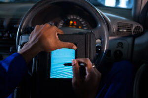 mechanic using touchscreen device
